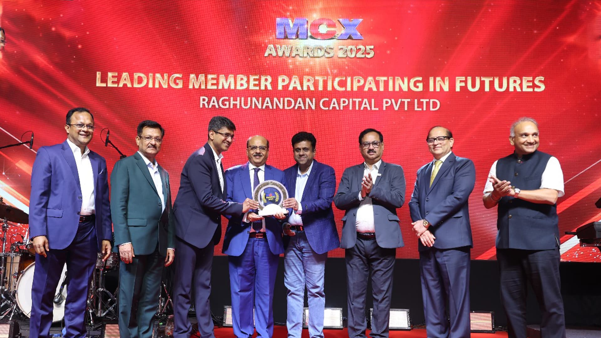 Raghunandan Capital Pvt Ltd receiving the MCX Awards 2025 for Leading Member Participating in Futures, on stage with dignitaries and team members